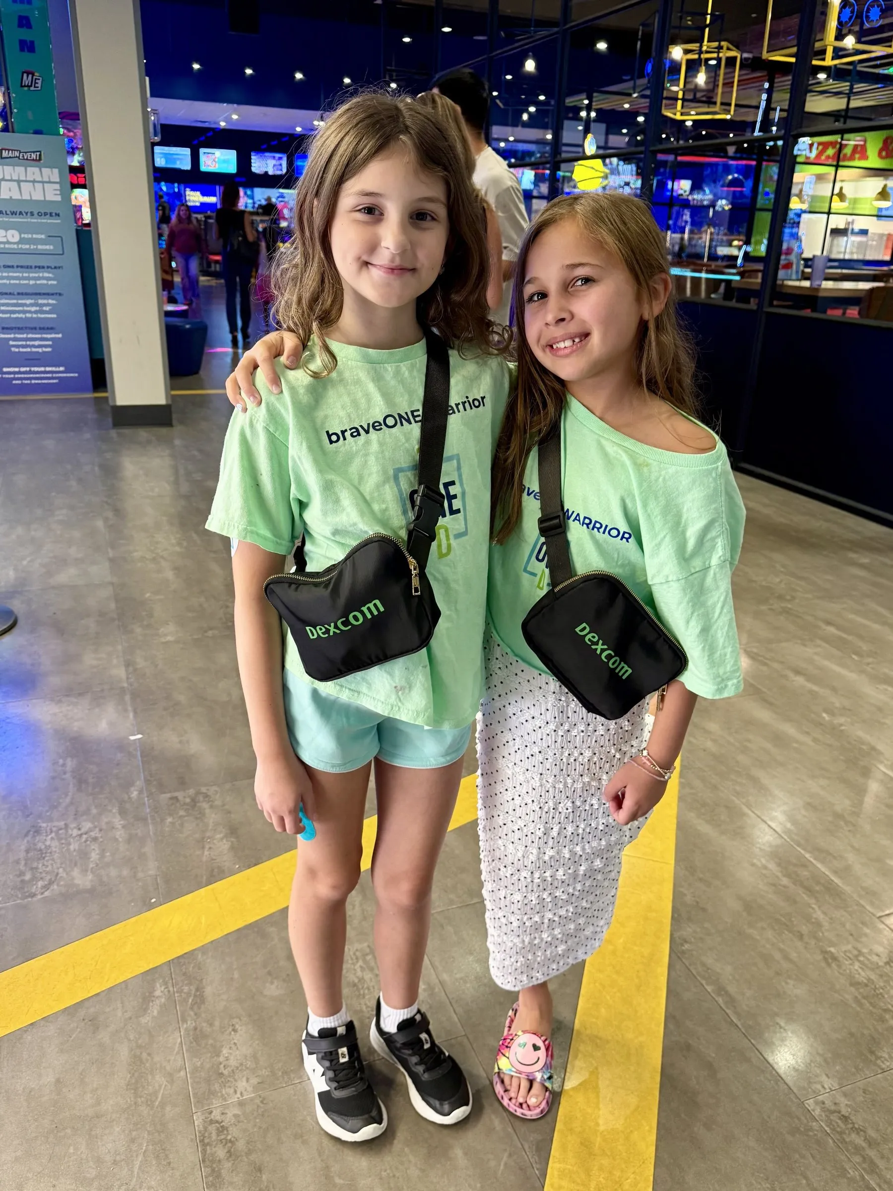 Two braveONE warriors in matching braveONE t-shirts