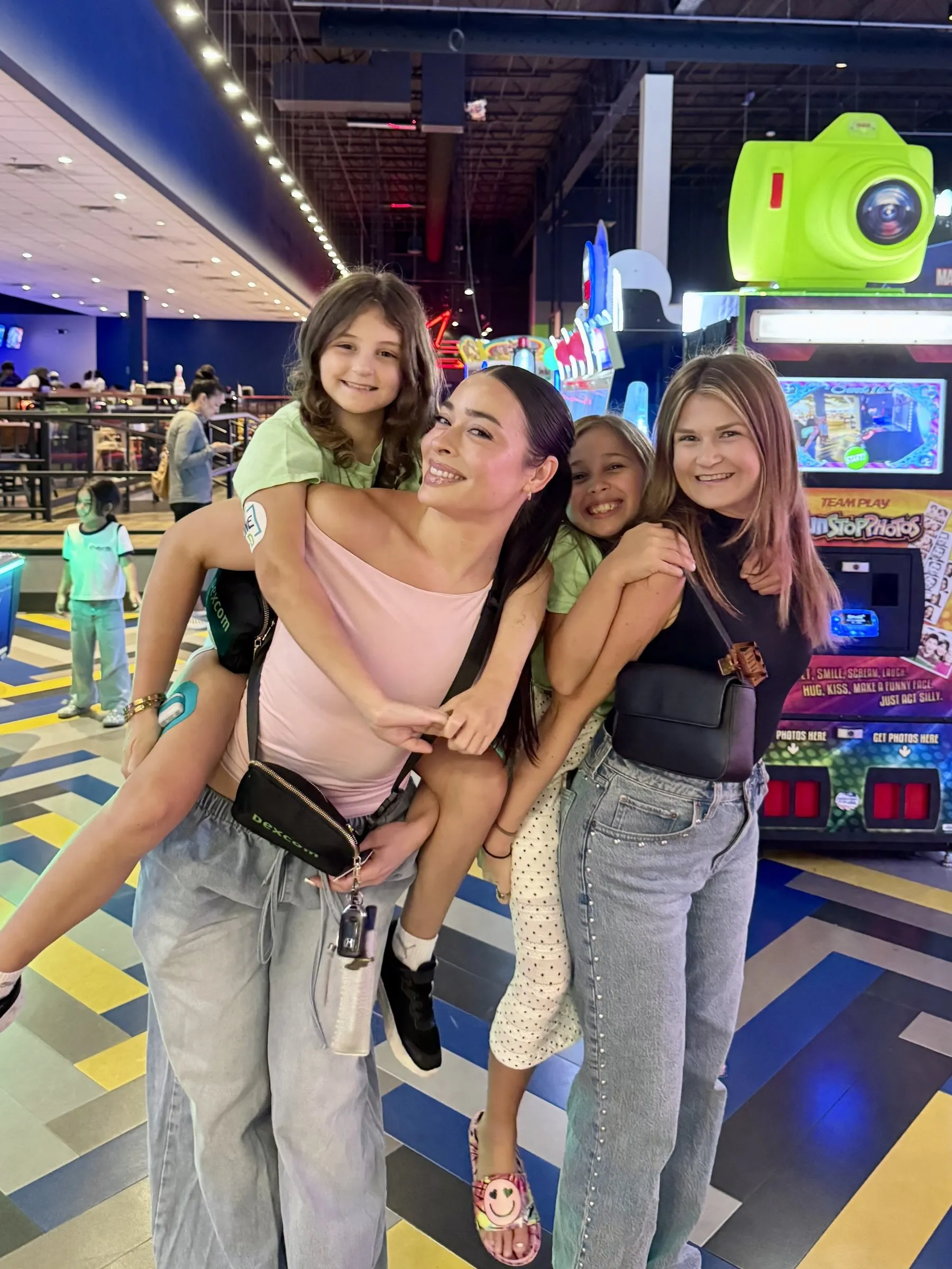 braveONE mentors and mentees having fun together at an arcade